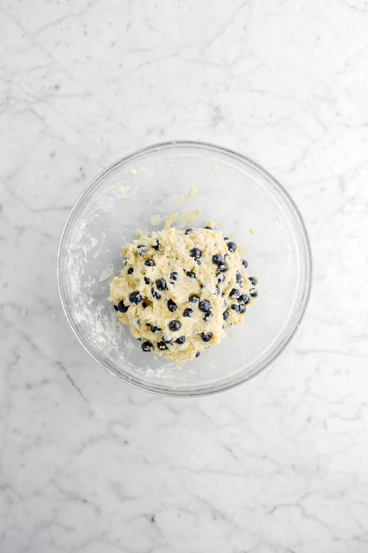 lemon blueberry scone dough in glass bowl