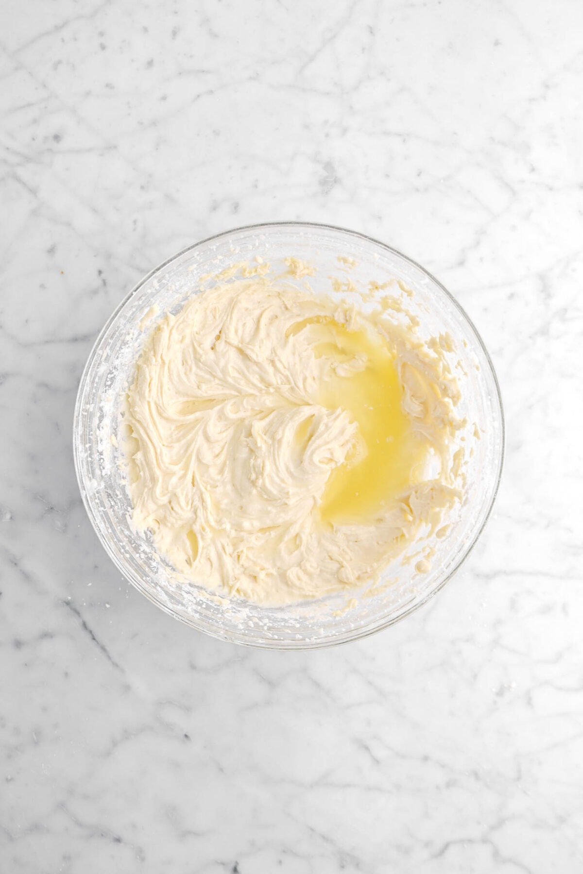 lemon juice and cake batter in glass bowl