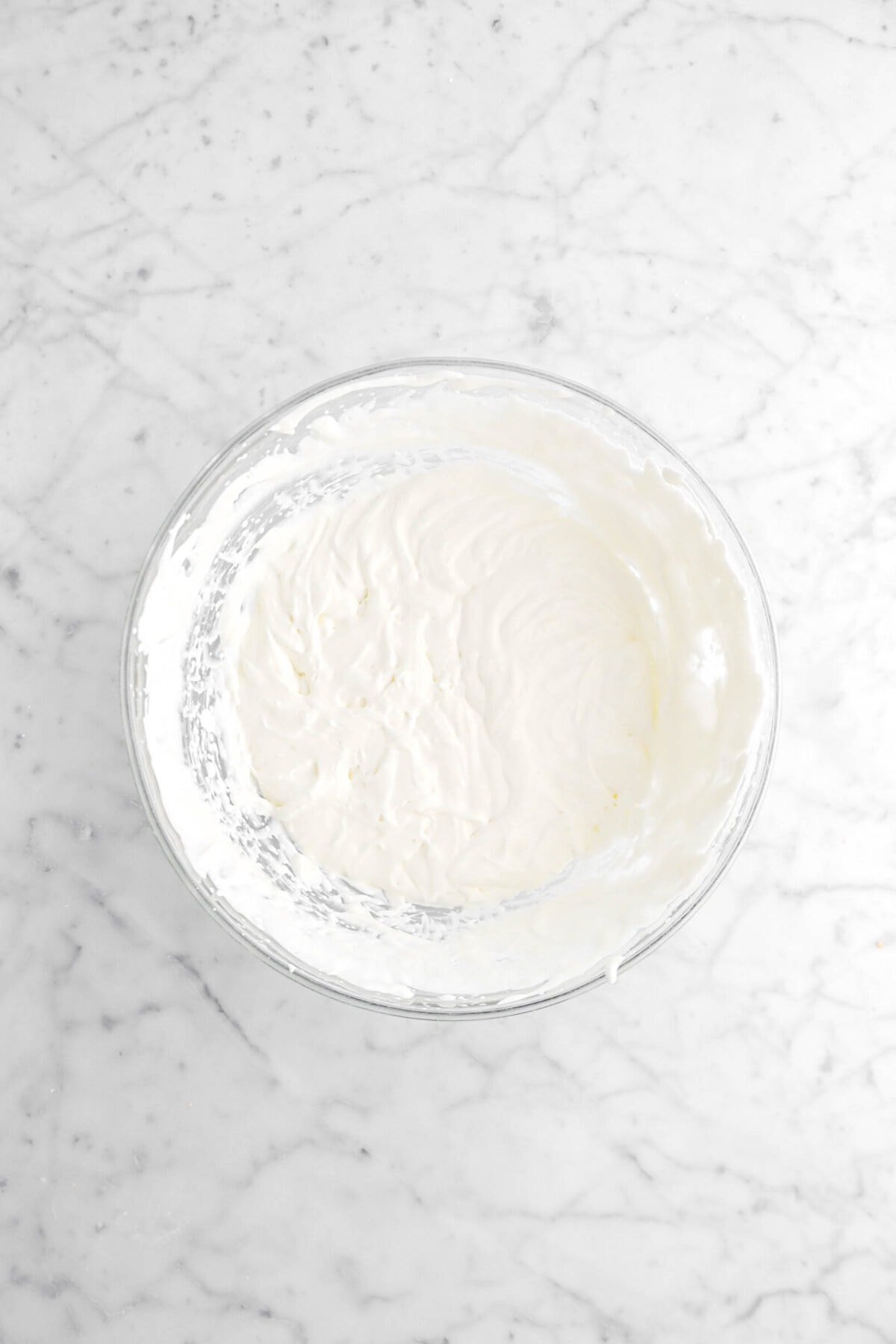 whipped heavy cream in glass bowl