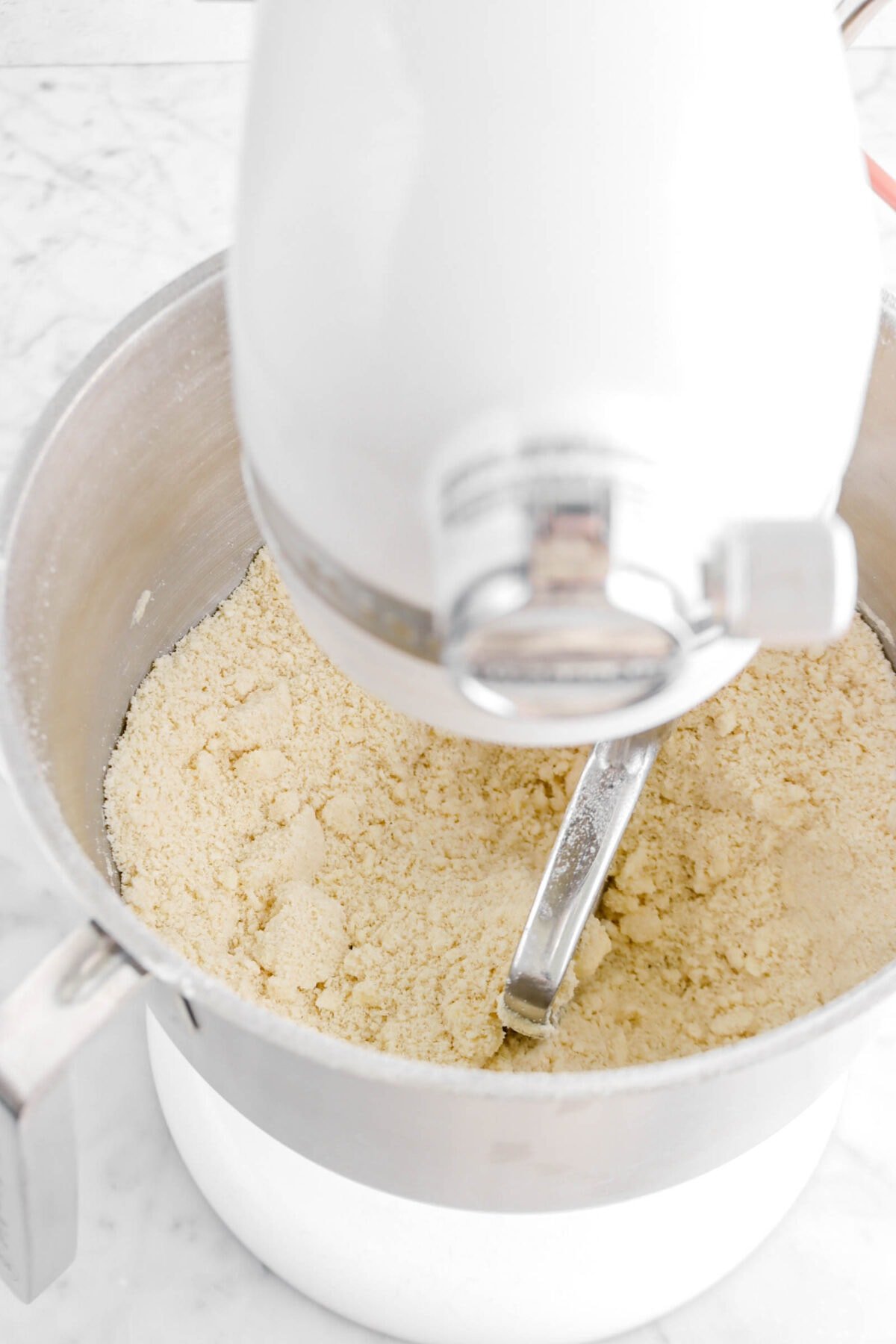 crumbly dough mixture in stand mixer