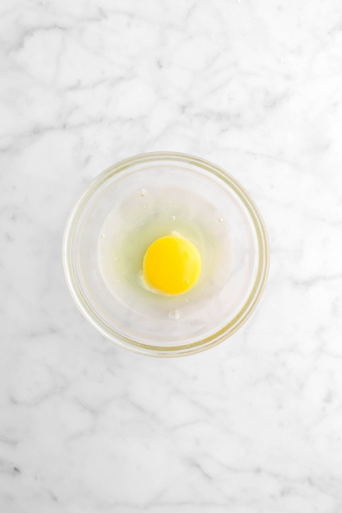 egg and water in small glass bowl