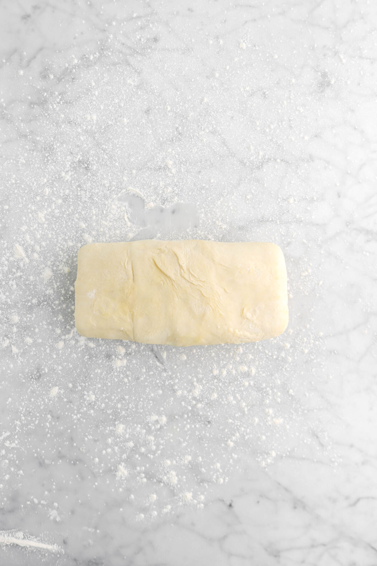 smooth pastry dough on floured surface
