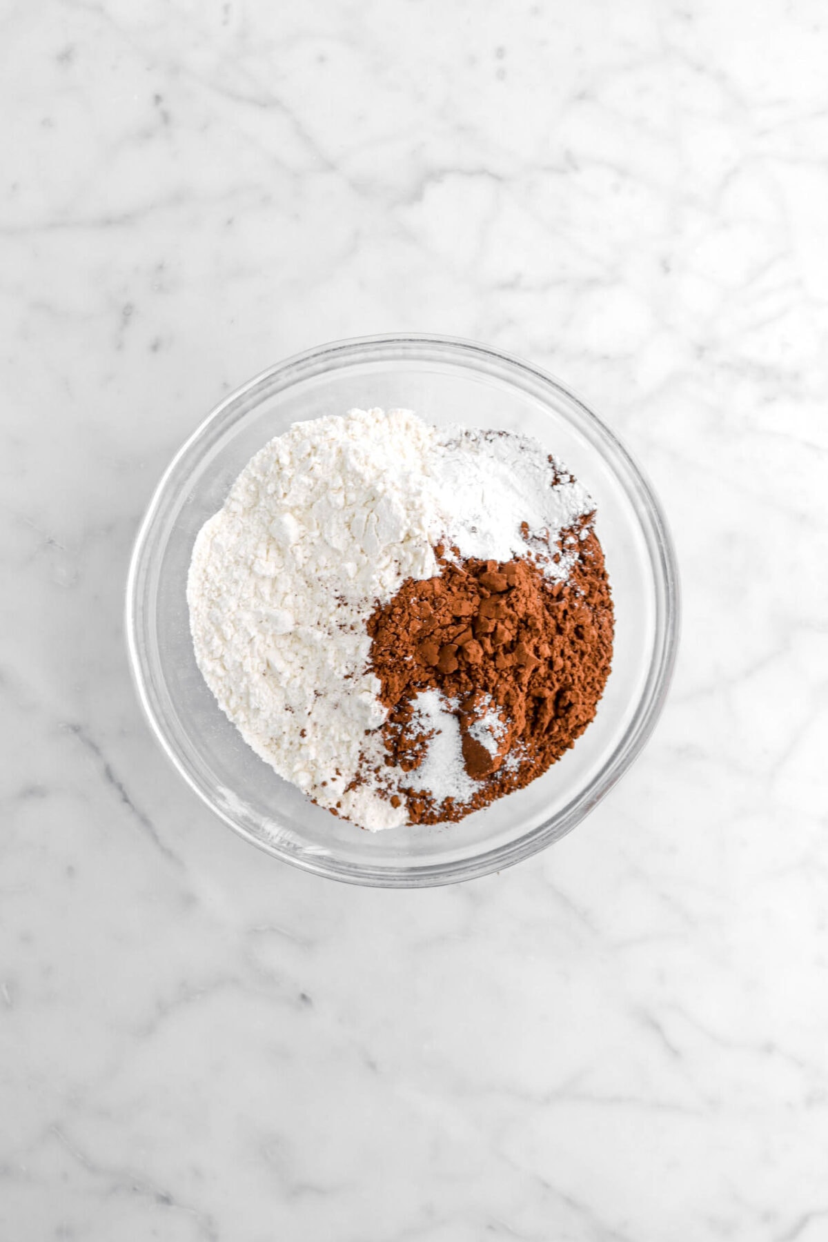 flour, cocoa powder, salt, and baking powder in glass bowl