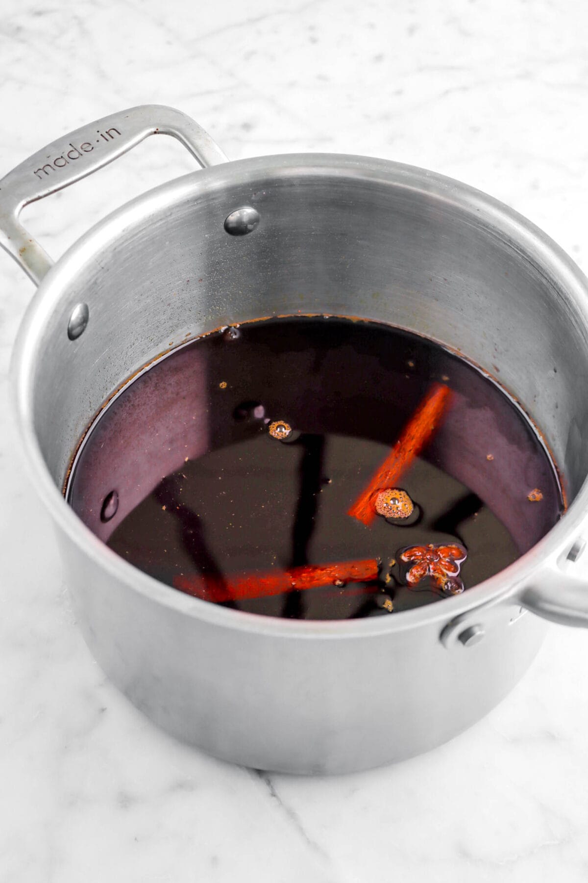 mulled wine in pot on marble surface