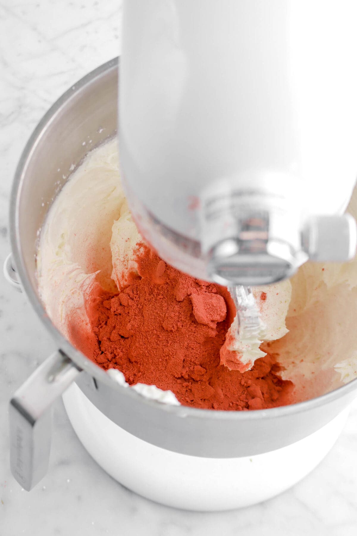 strawberry powder and butter cream in stand mixer