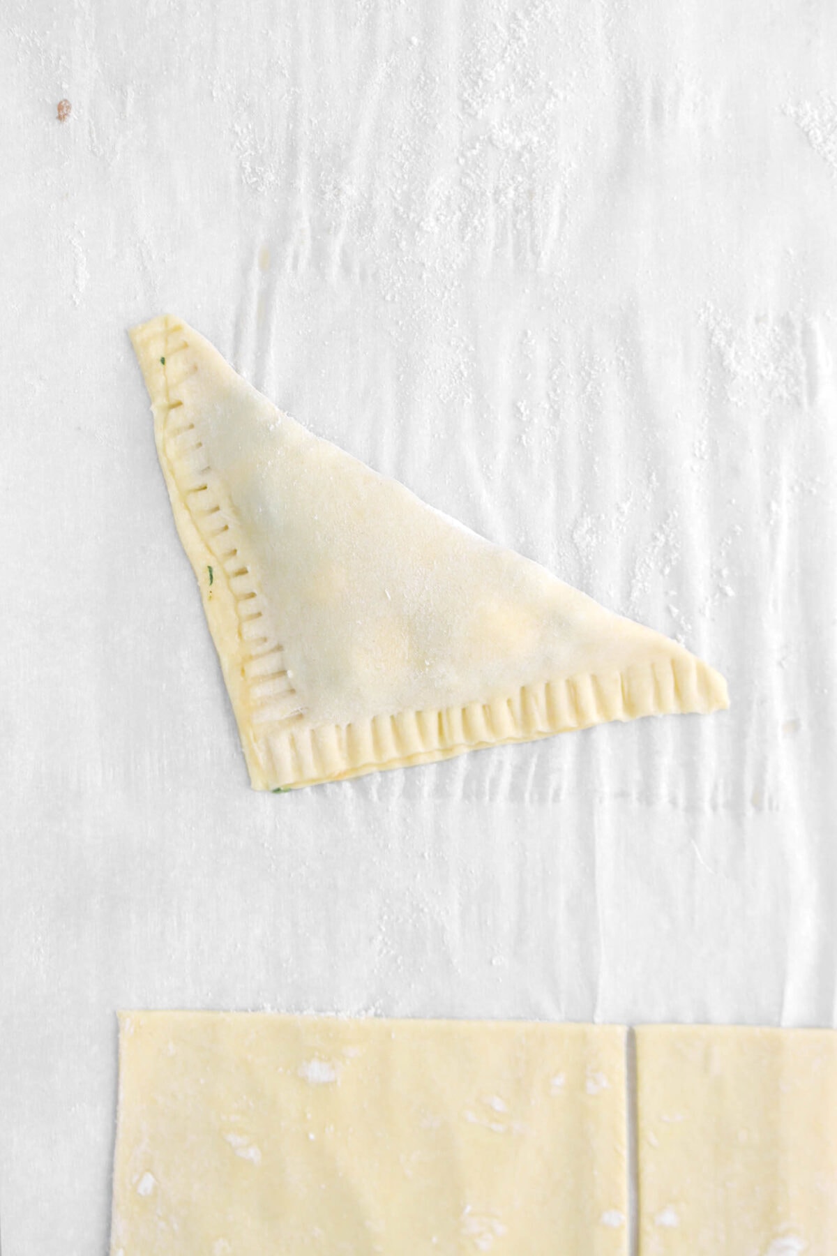 sealed turnover on parchment paper
