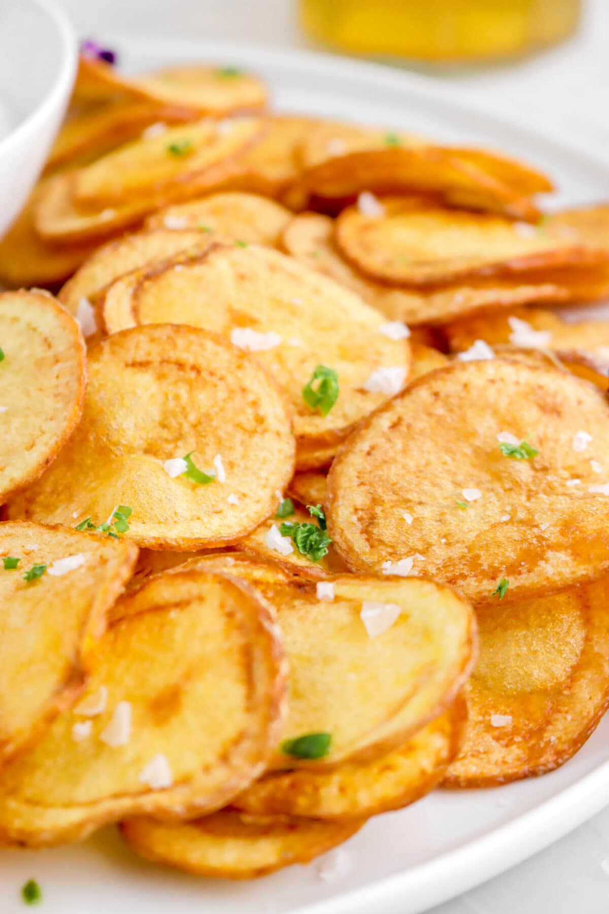 close up of potato chips on white plate