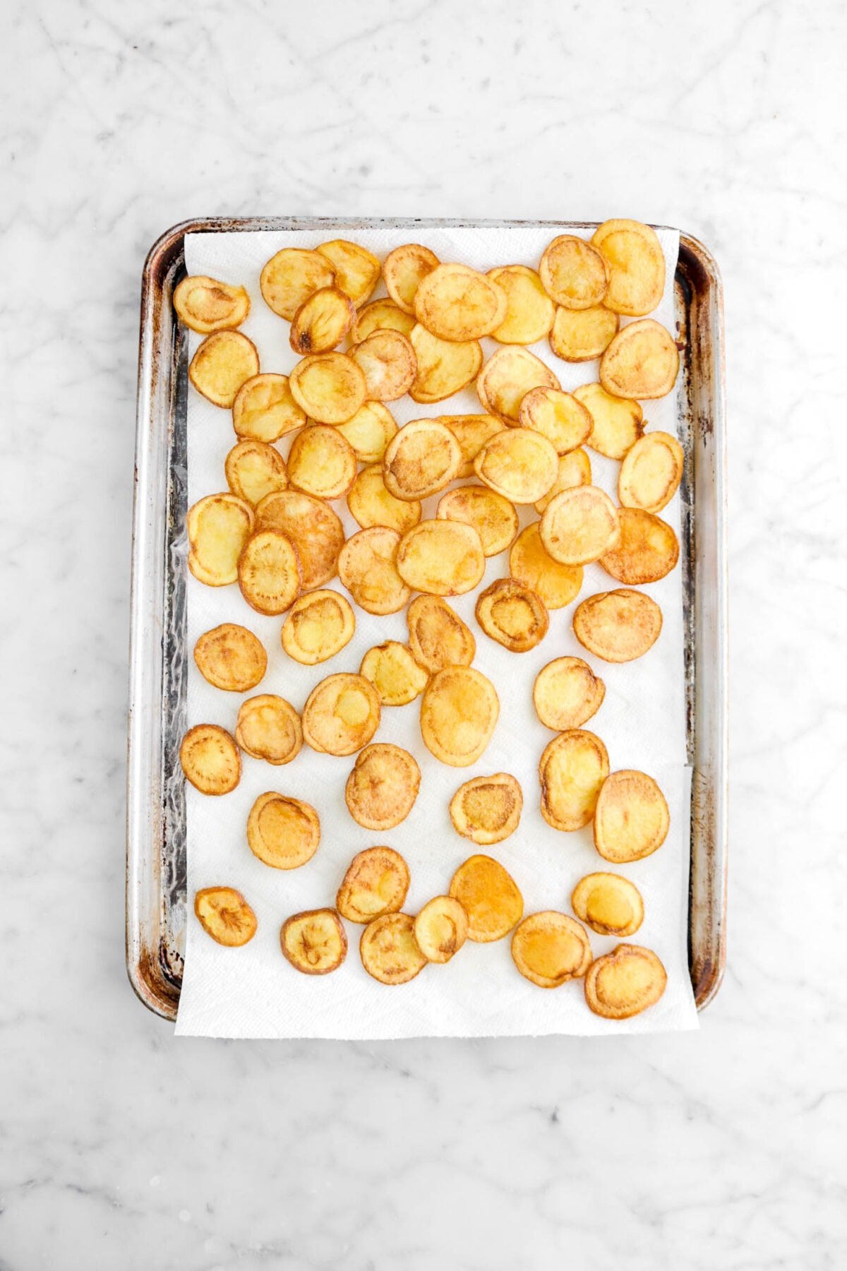 fried potato chips on sheet pan