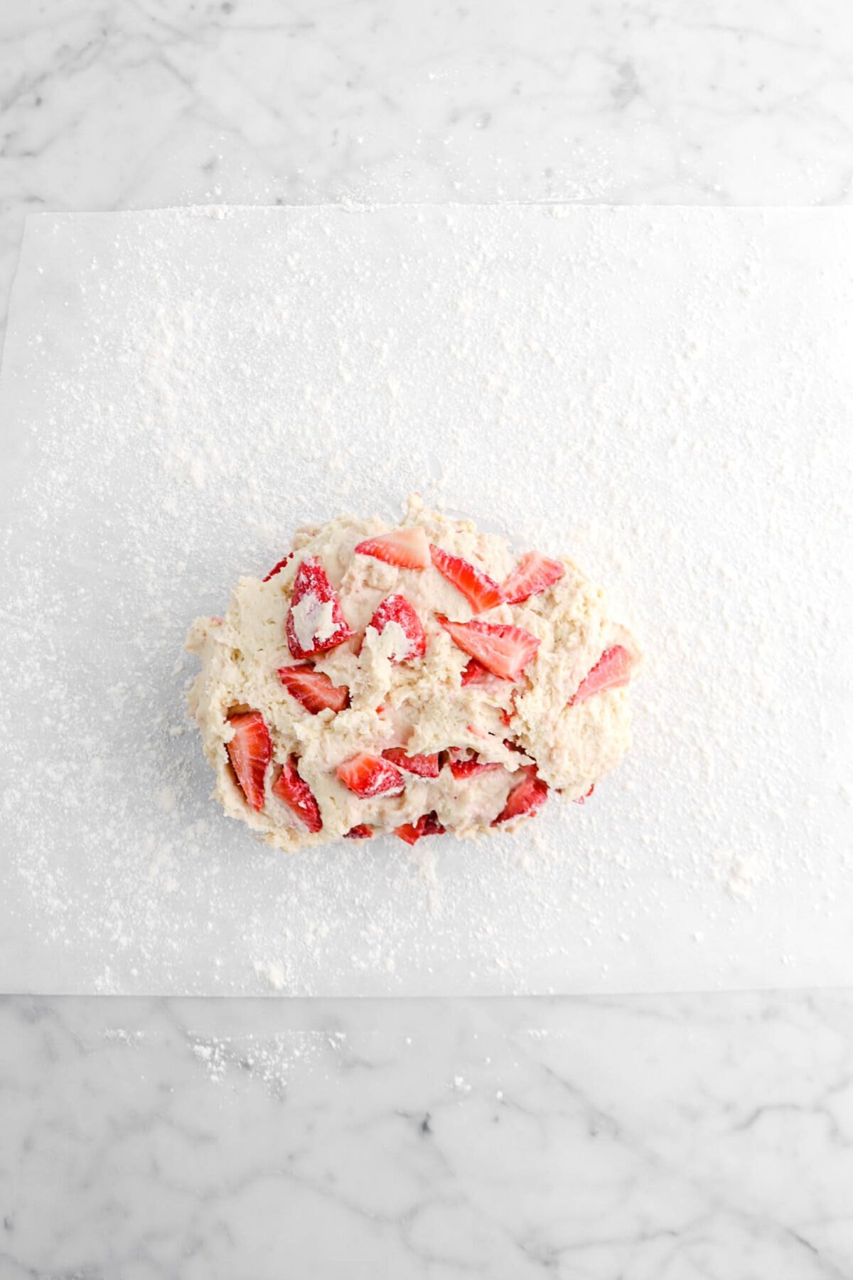 strawberry scone dough on floured parchment paper