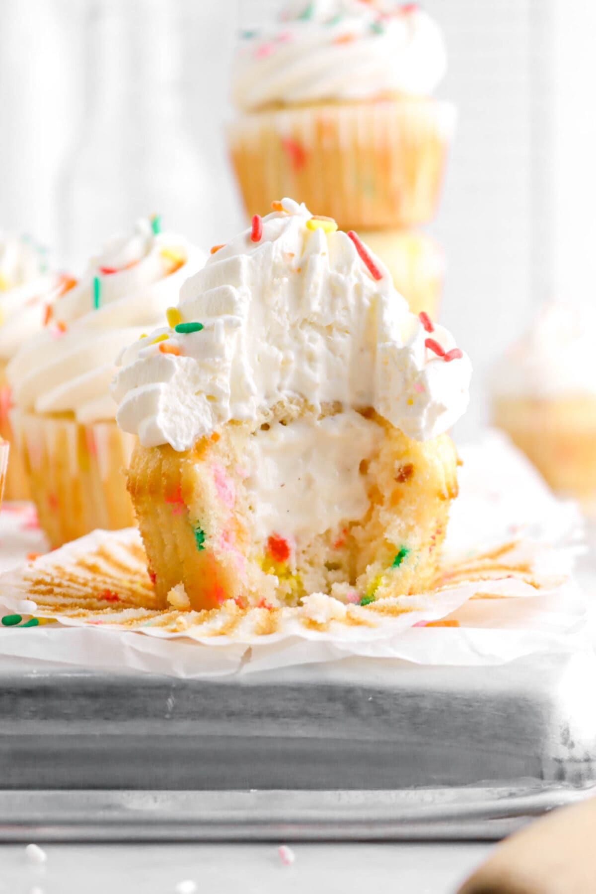 close up of cupcake filled with ice cream on upside down sheet pan