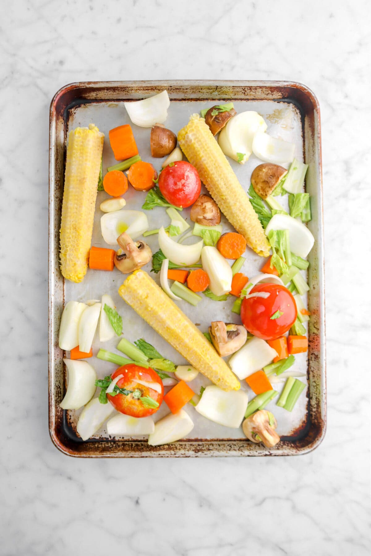 vegetables on sheet pan on marble surface