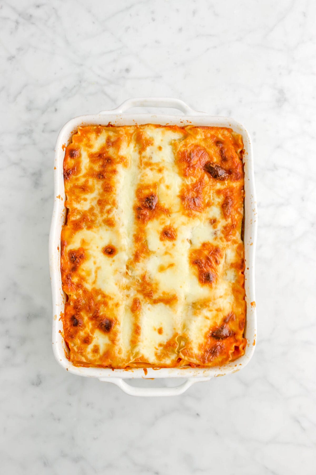 baked lasagna on marble surface
