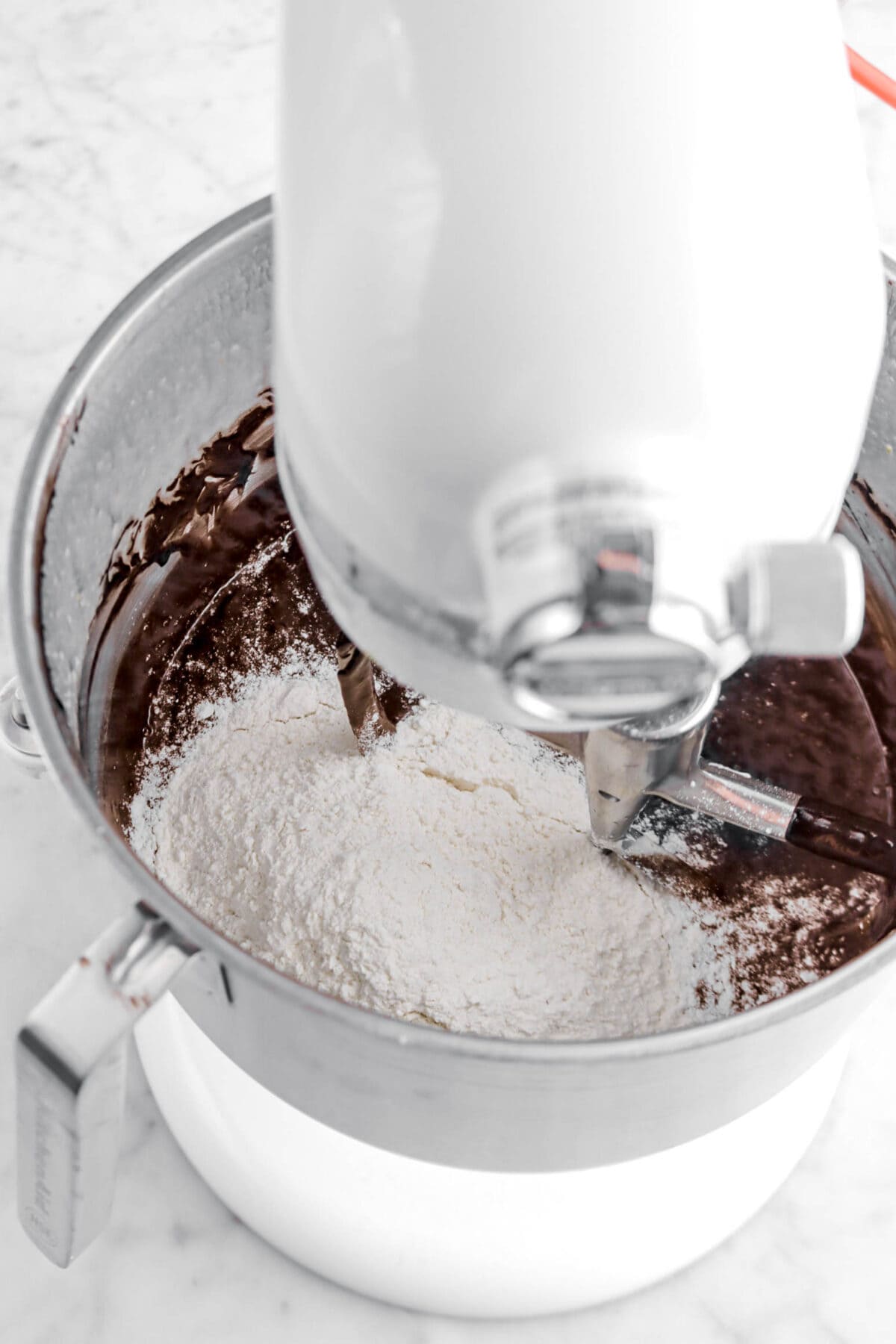 flour added to chocolate mixture in stand mixer.
