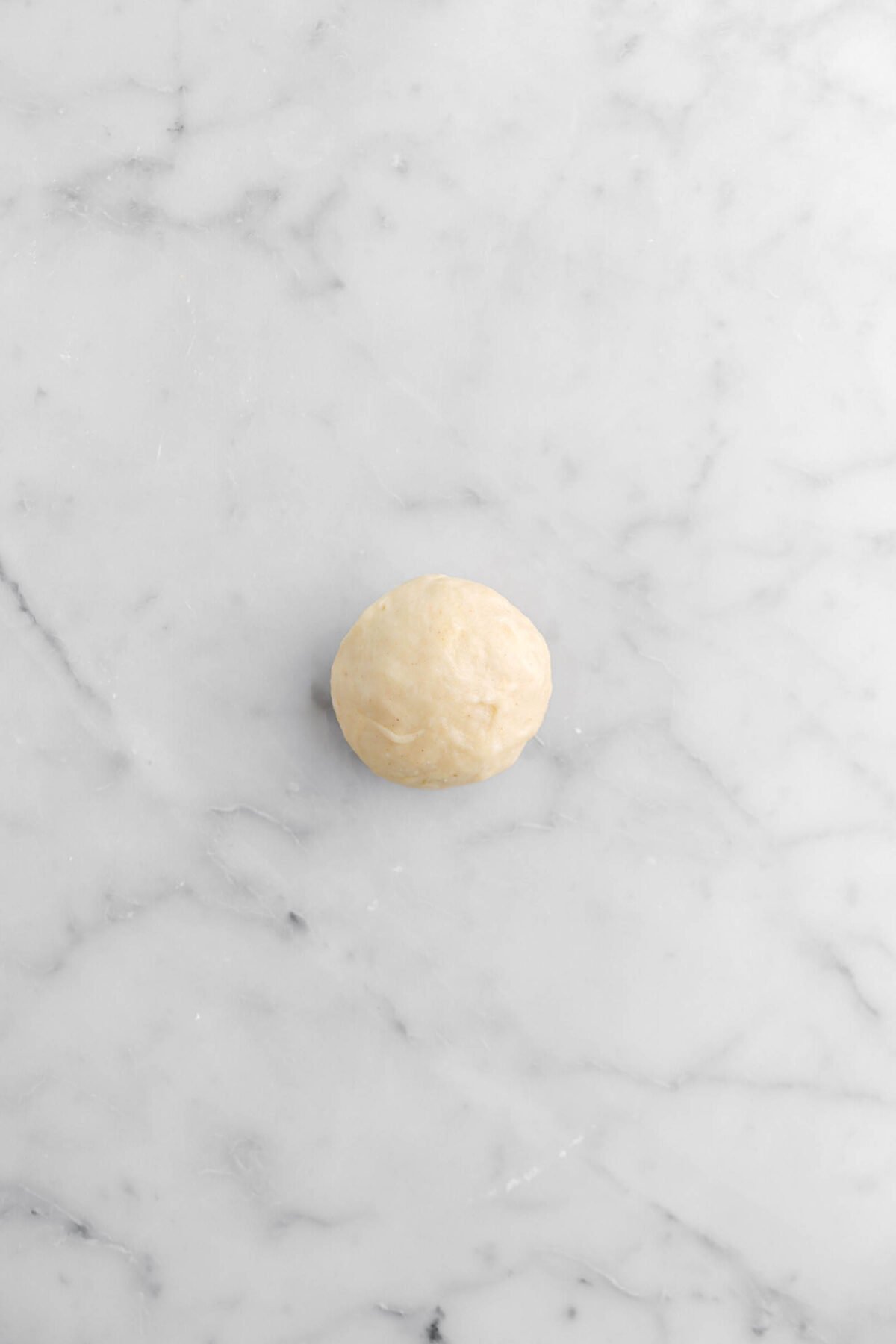 dough ball on marble surface
