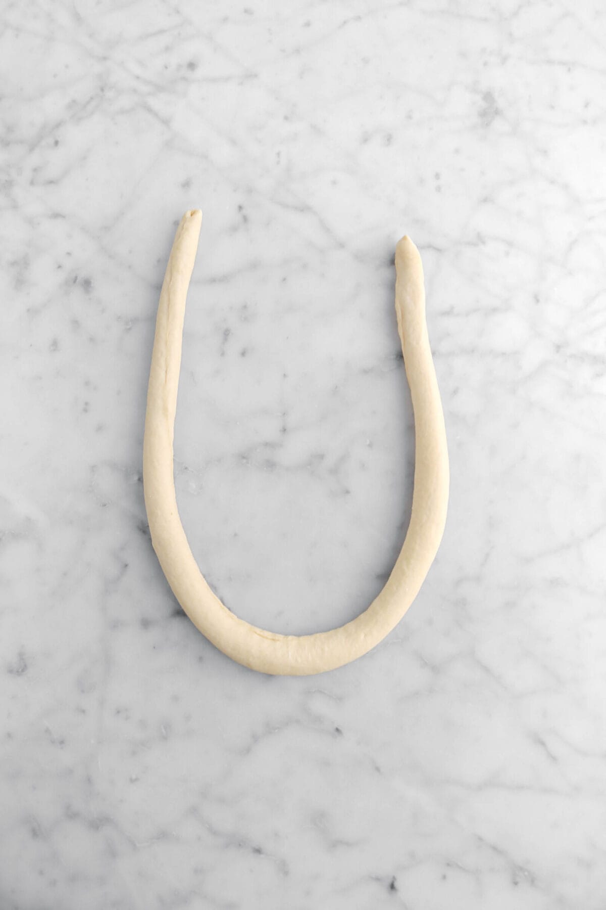 dough rope shaped in a, "U" shape.