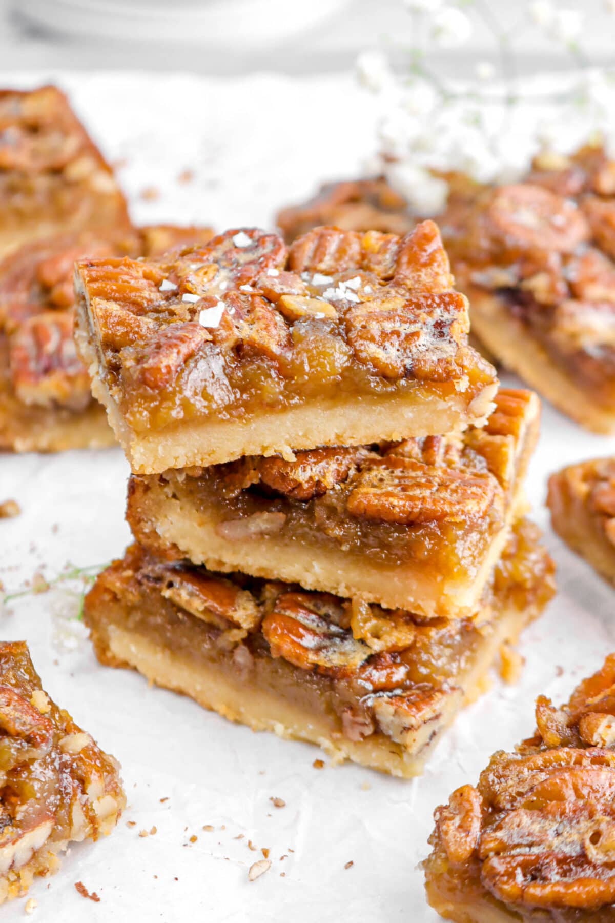 angled close up of three stacked pecan pie bars