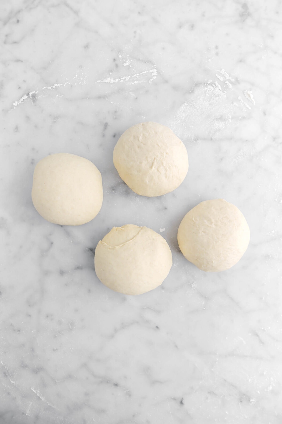 dough divided into four balls.