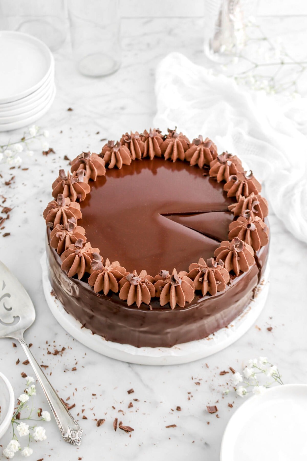 angled shot of mousse cake with slice cut into it.