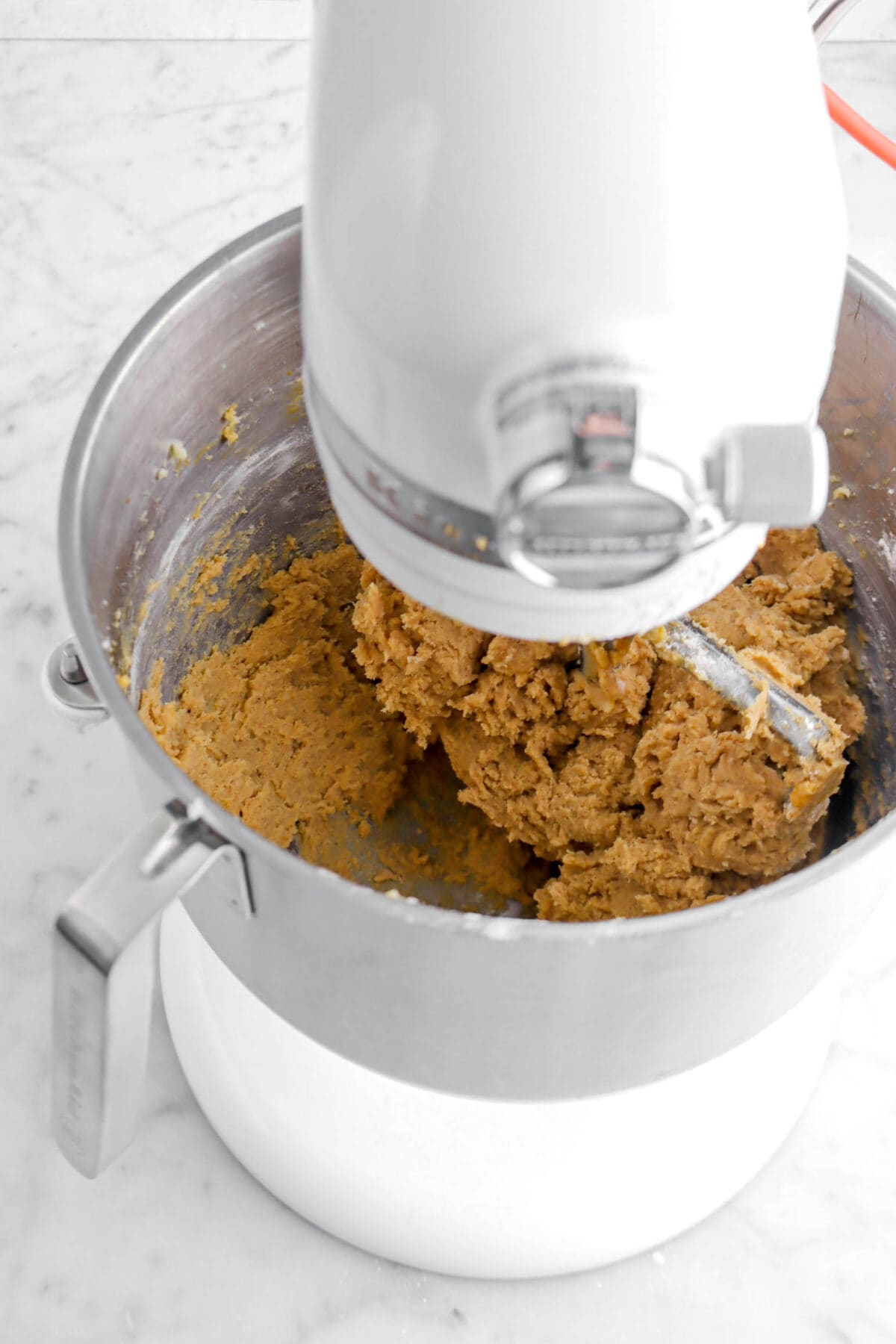 pumpkin cookie dough in stand mixer.