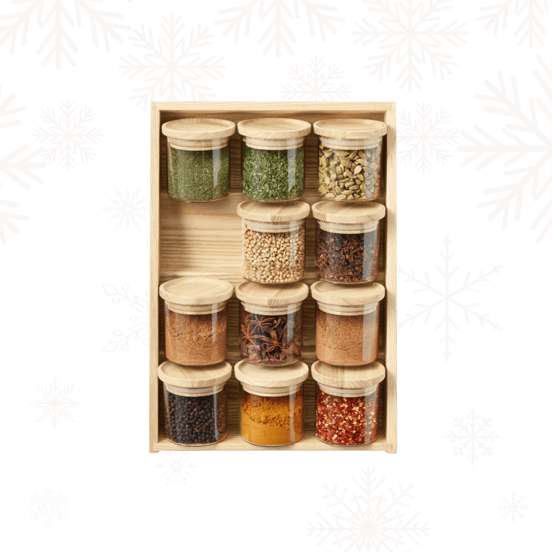 wood box with glass jars filled with spices.