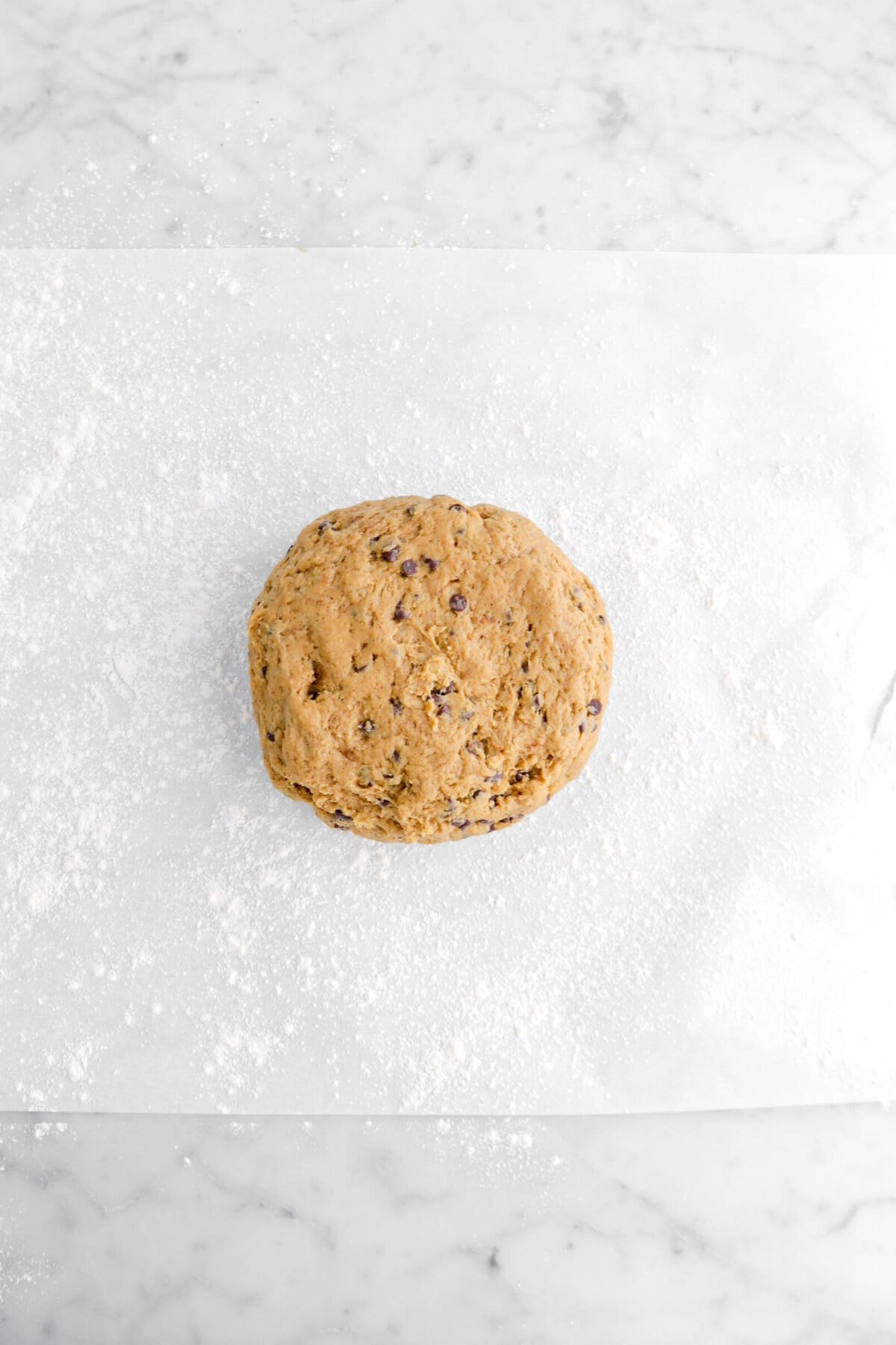 scone dough on floured parchment paper.