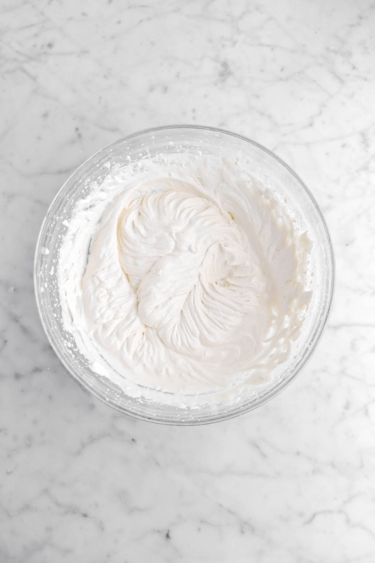 spiced whipped cream in glass bowl.