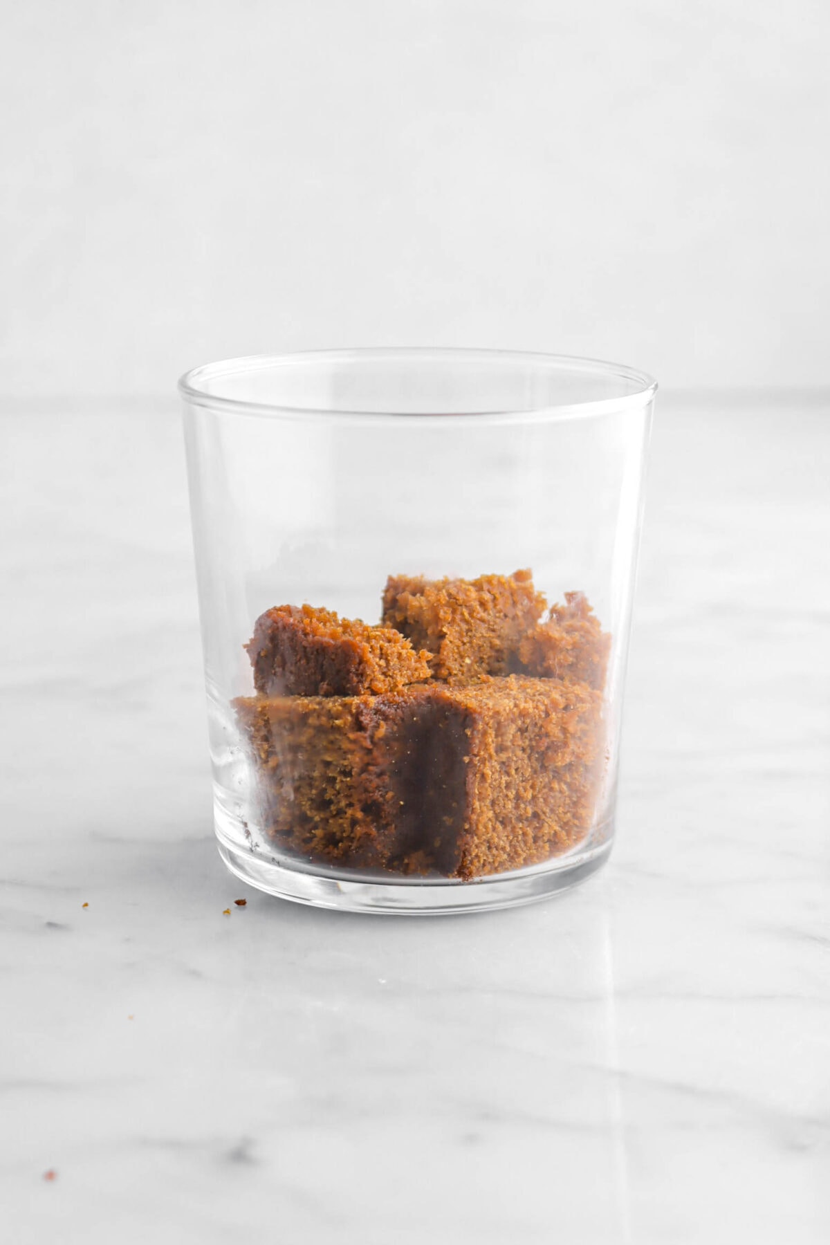 cubes of gingerbread cake in small glass.