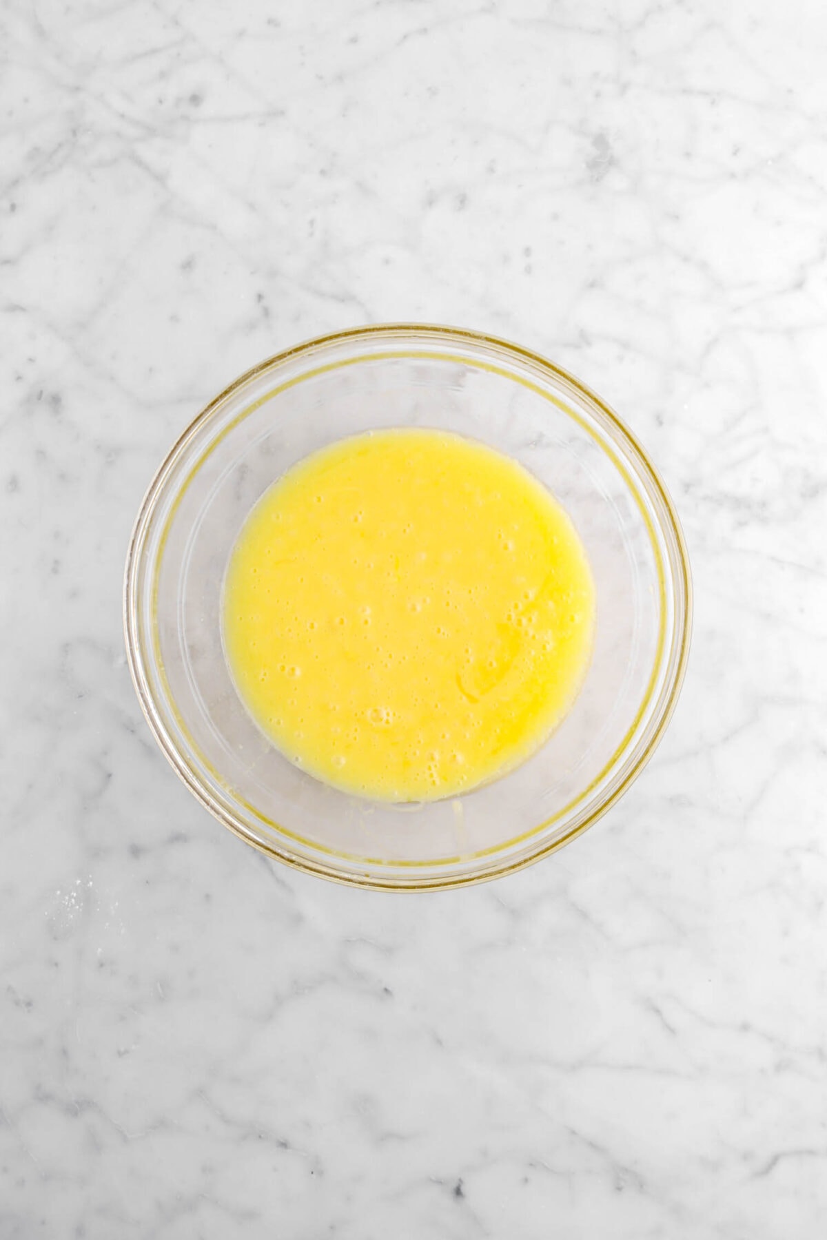 whisked egg mixture in glass bowl.