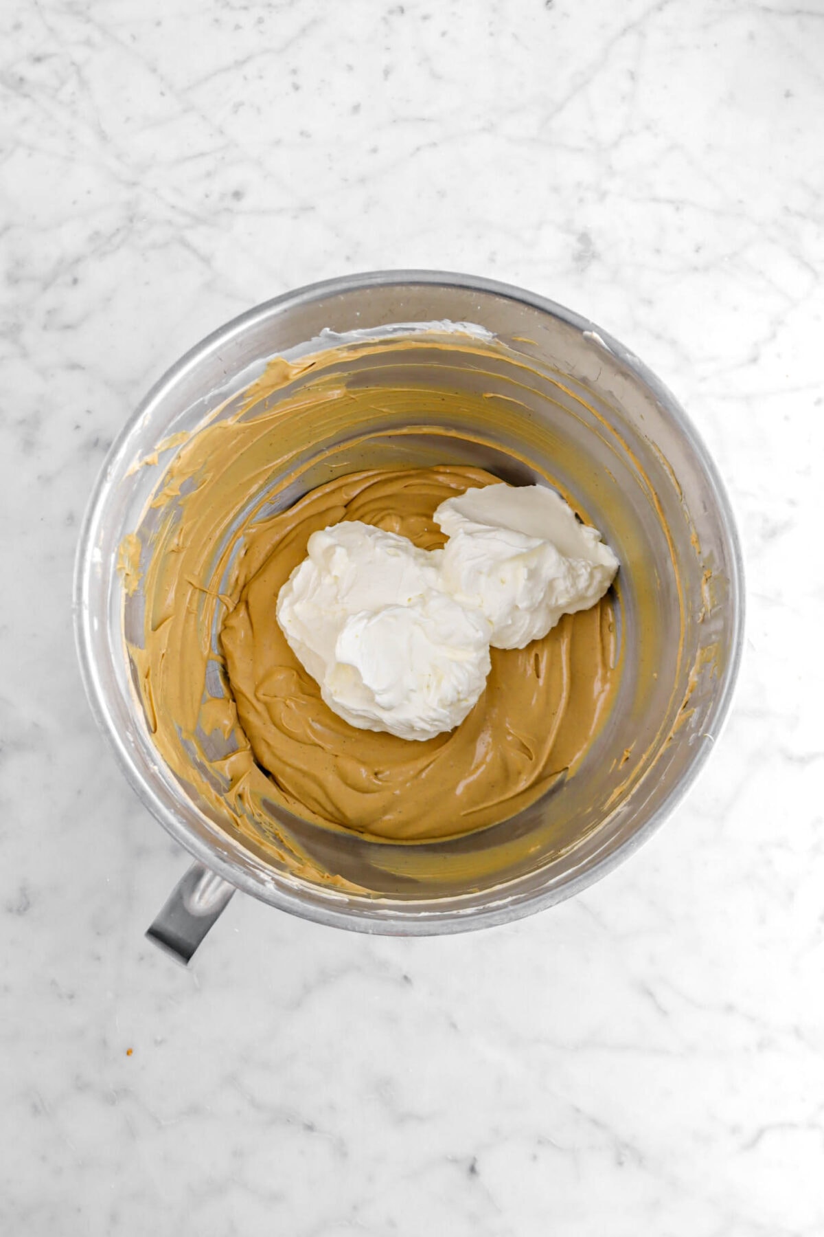 whipped cream added on top of cream cheese molasses mixture.