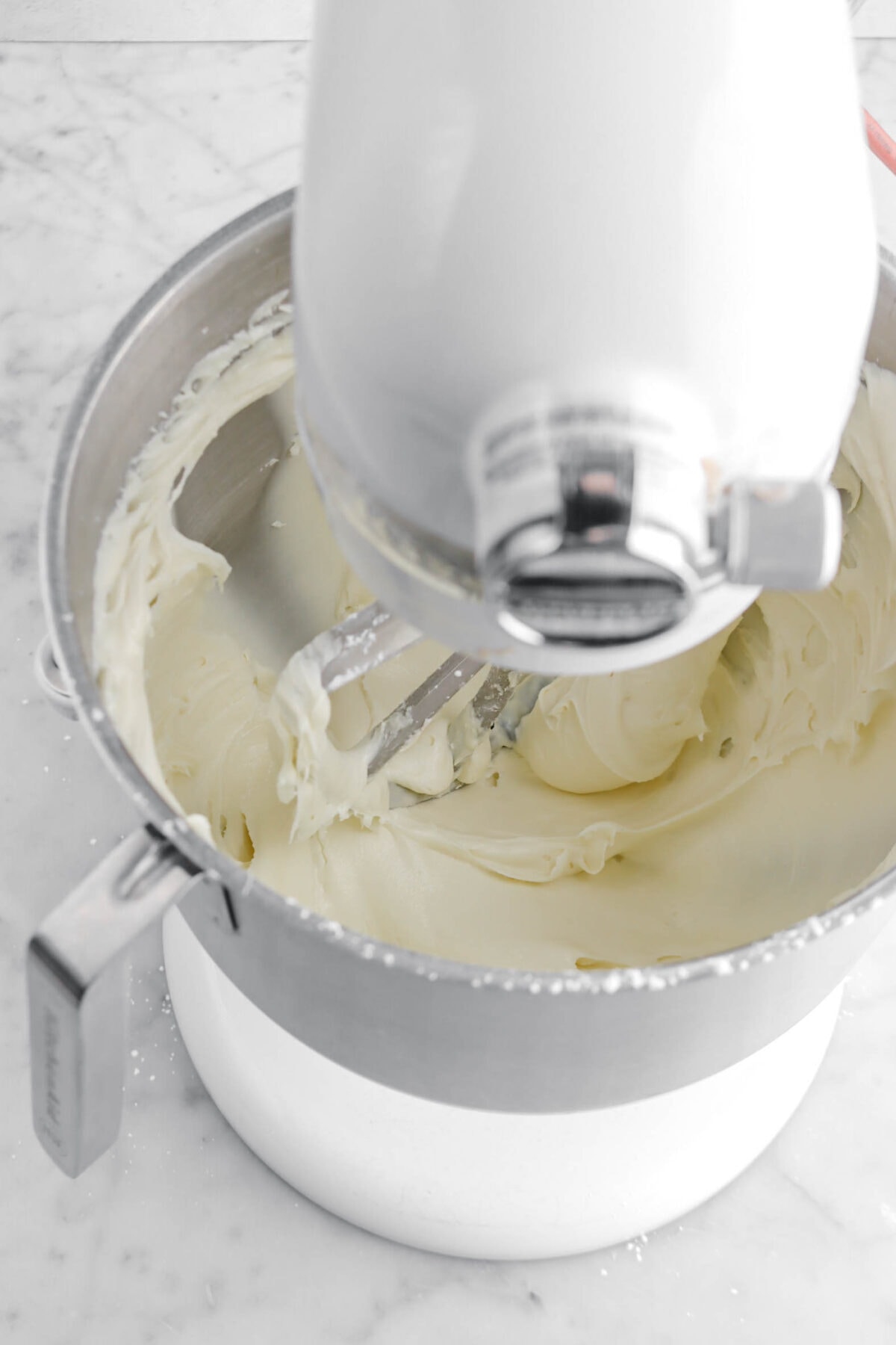 white chocolate frosting in stand mixer.