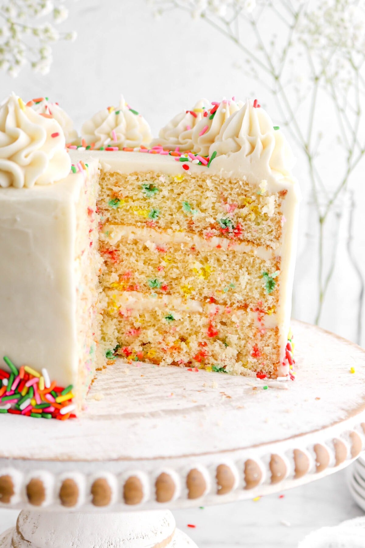 close up of funfetti cake with slice missing.
