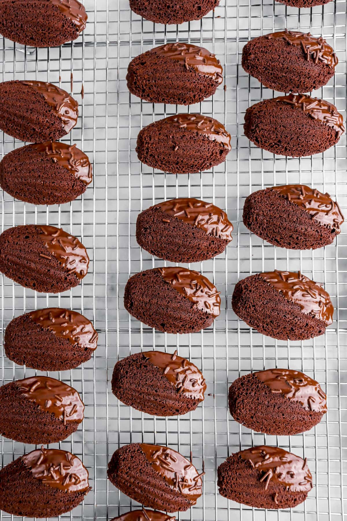 dipped madeleines on wire cooling rack.