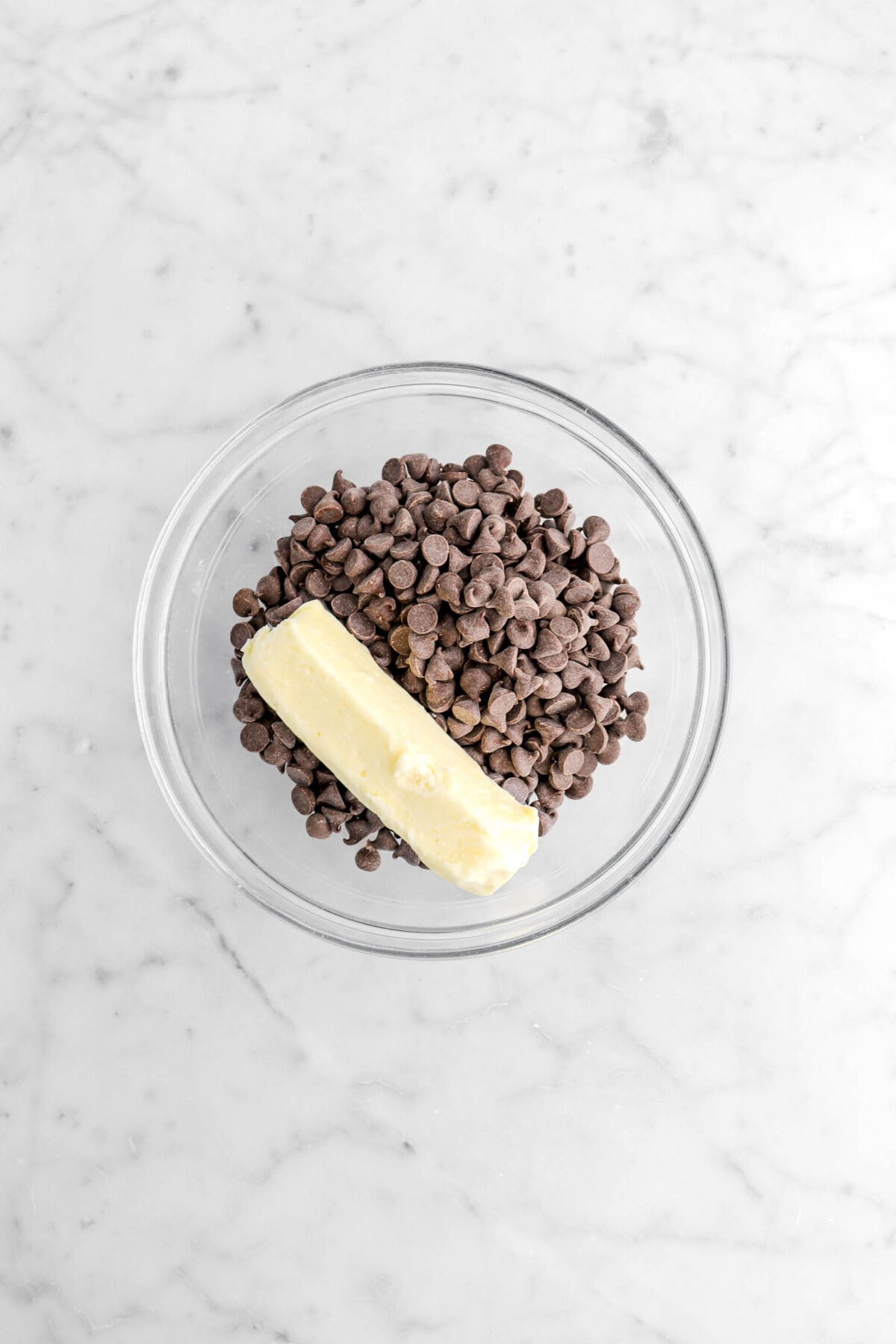 butter and chocolate chips in glass bowl.