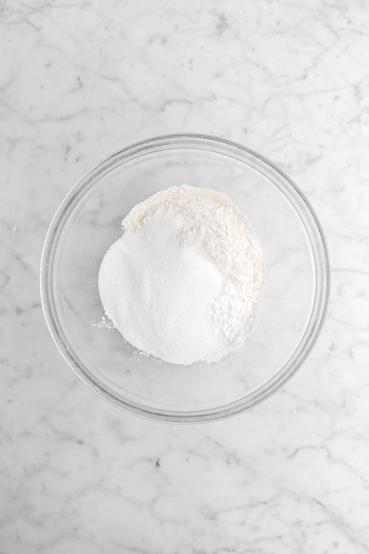 flour, sugar, baking powder, and salt in glass bowl.