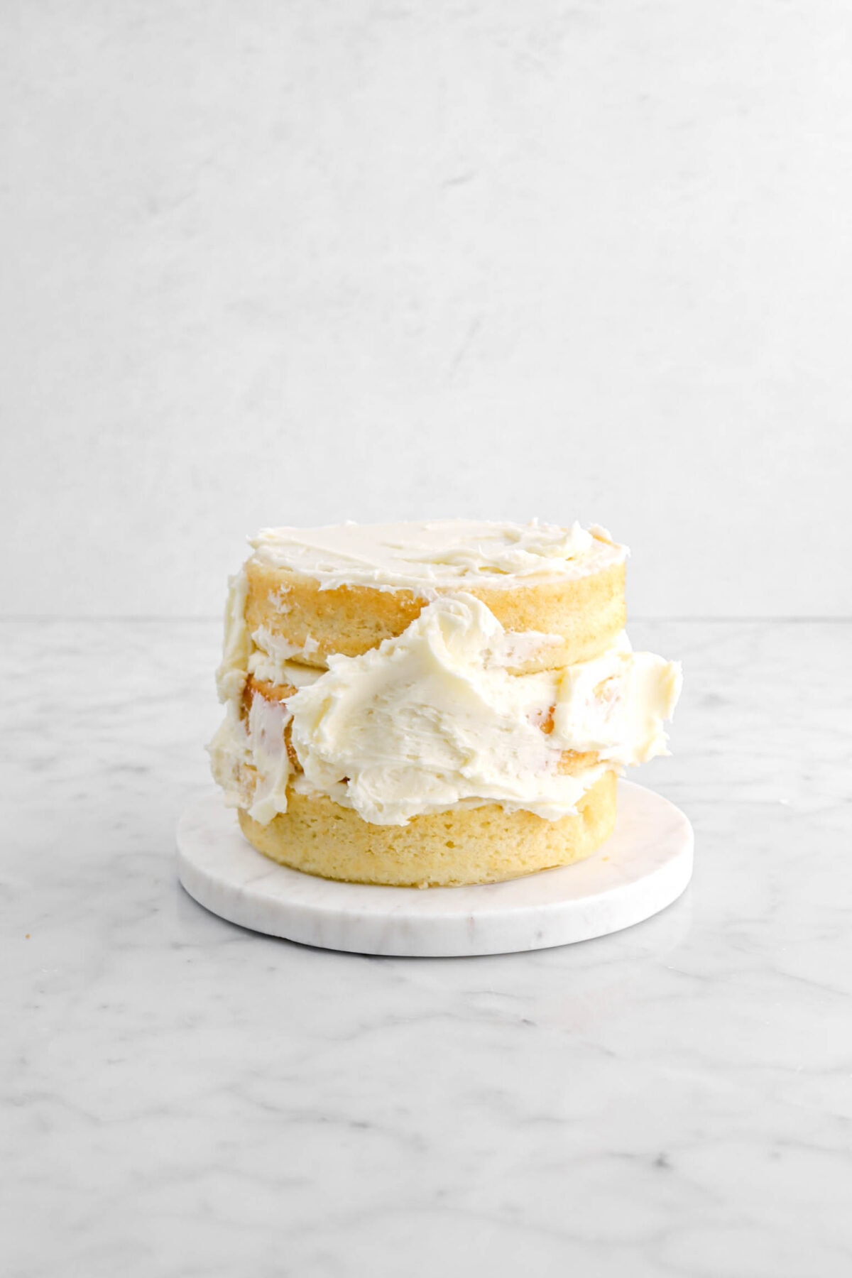 buttercream dolloped onto sides of cake.