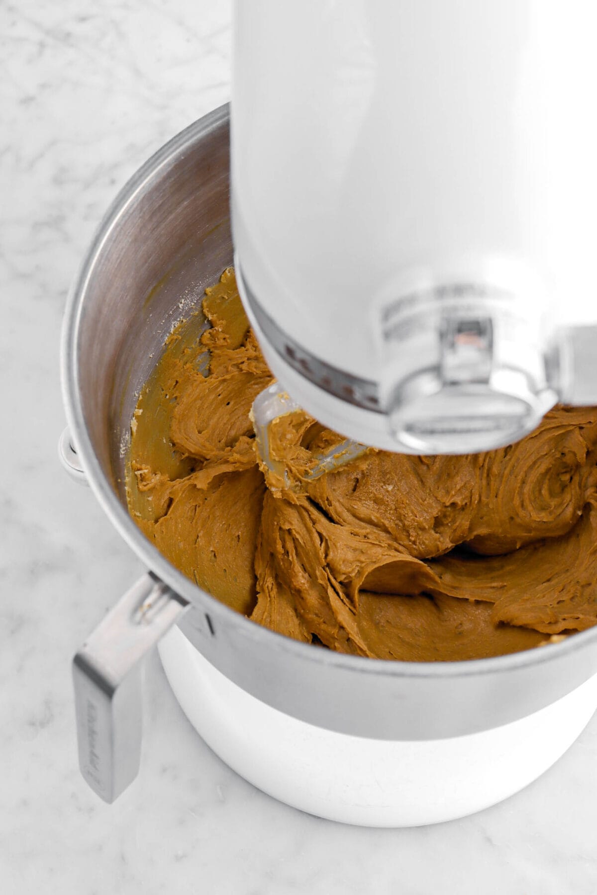 soft molasses cookie dough in stand mixer.