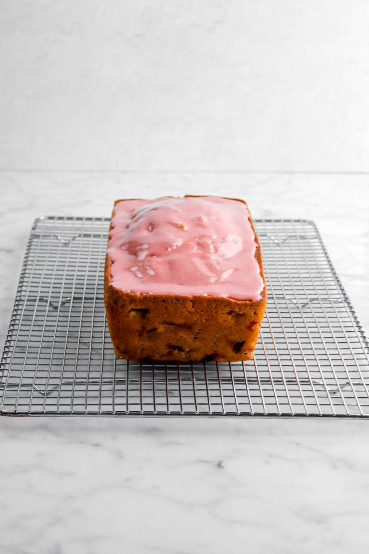 strawberry icing on top of bread loaf.