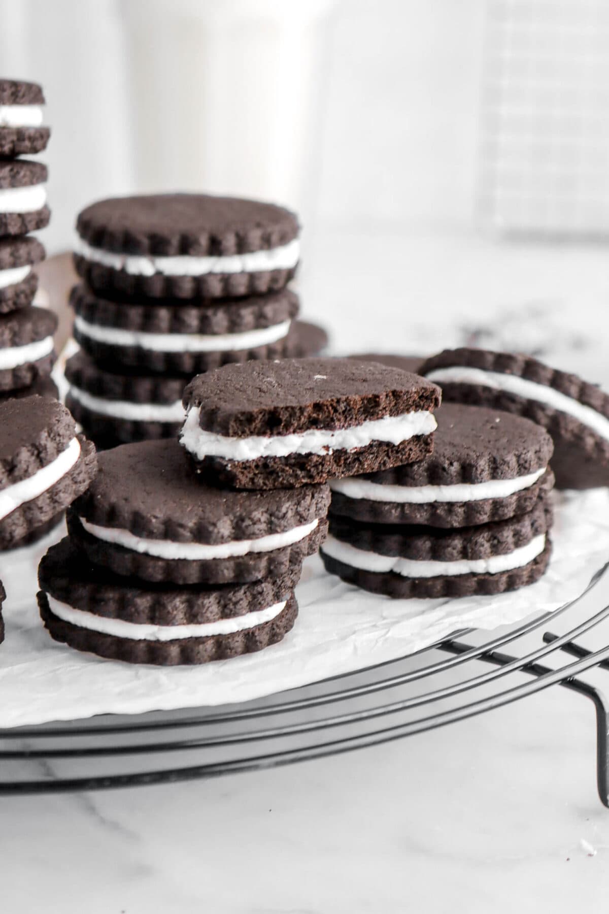 close up of stacked cookies with one cookie on top missing a bite.