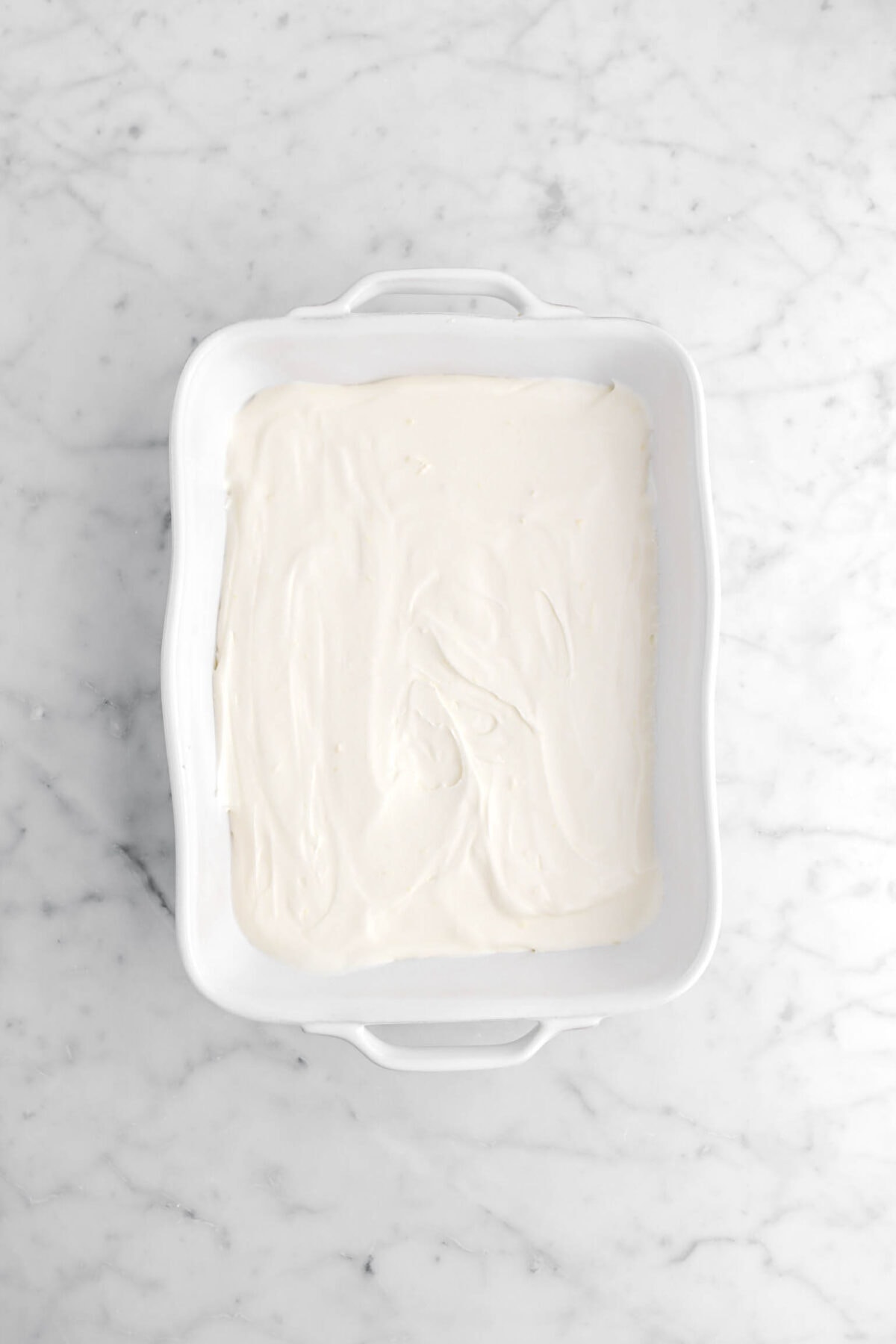 whipped cream spread across casserole. =