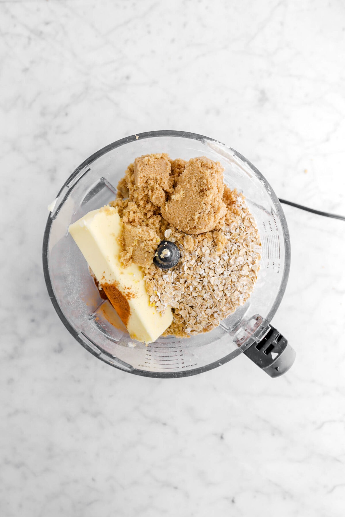 butter, cinnamon, brown sugar, and oats in food processor.
