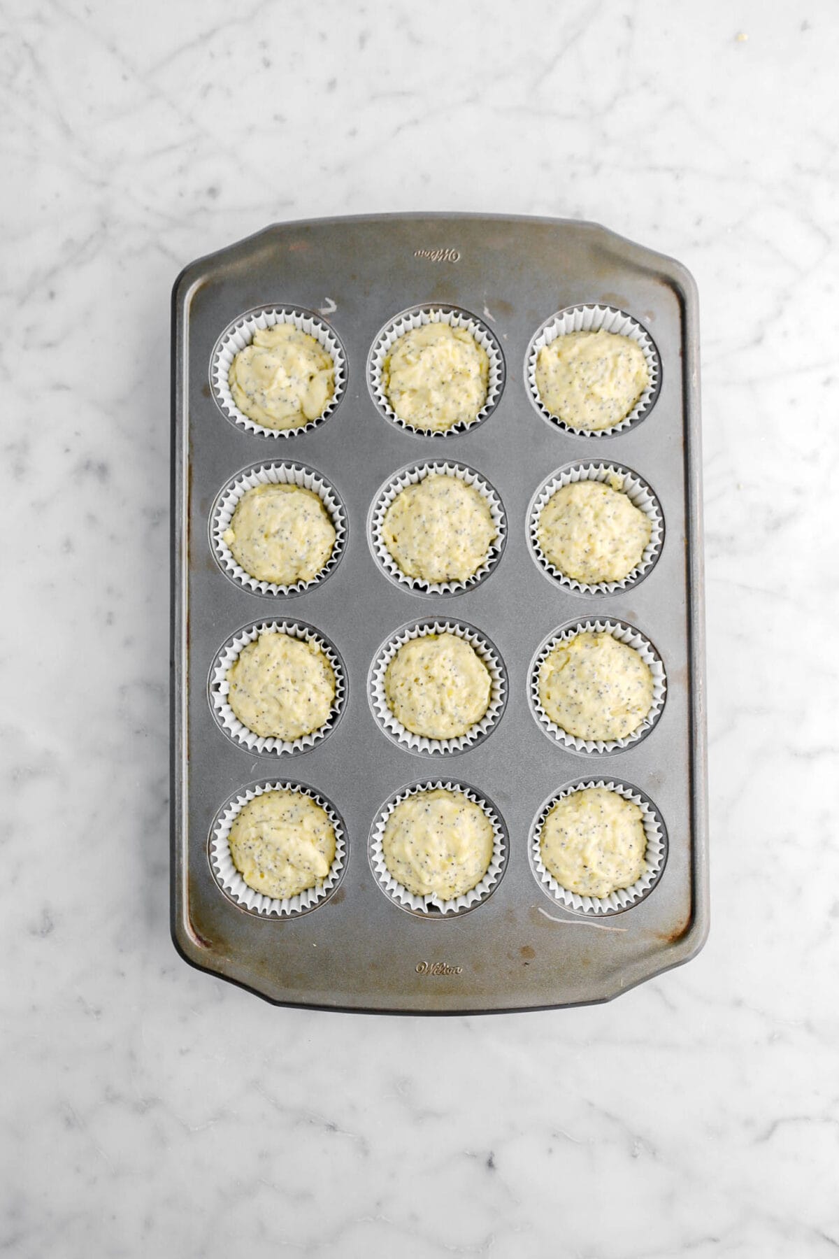 batter in lined muffin pan.