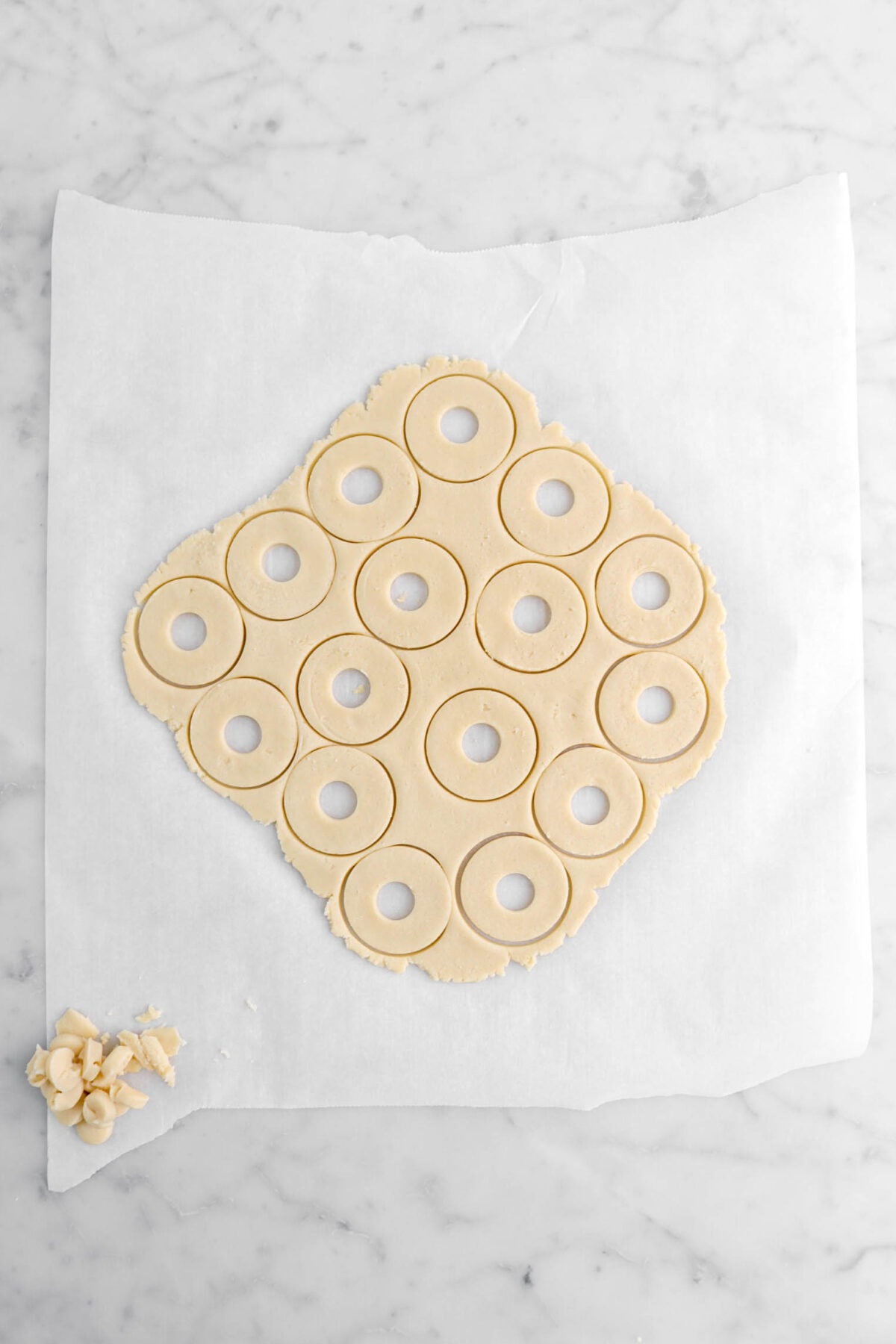 small circles cut into the middle of each round of shortbread on parchment paper.