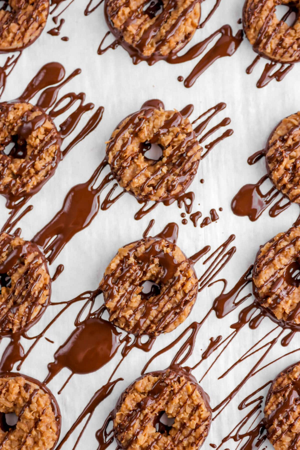 chocolate drizzled over samoas cookies.