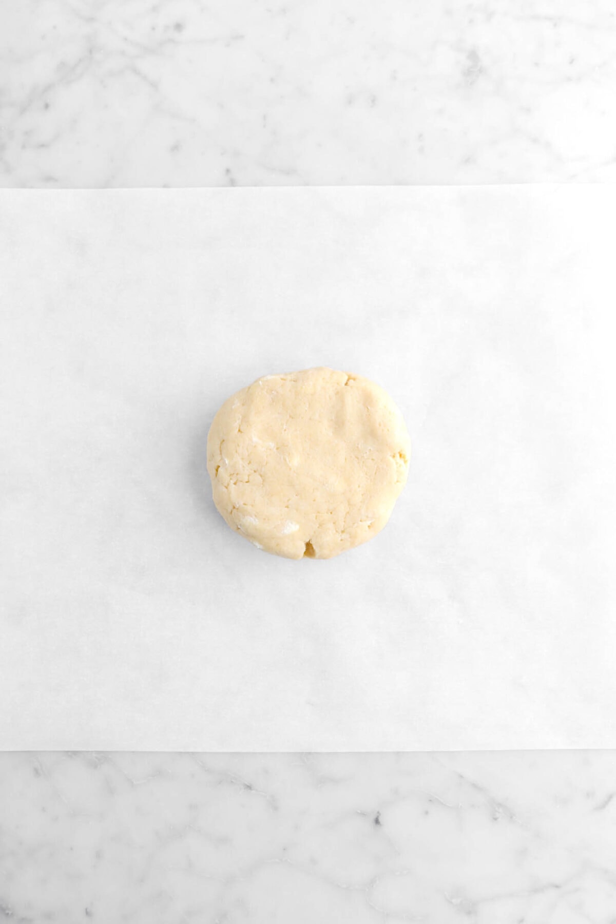pie dough on parchment paper.