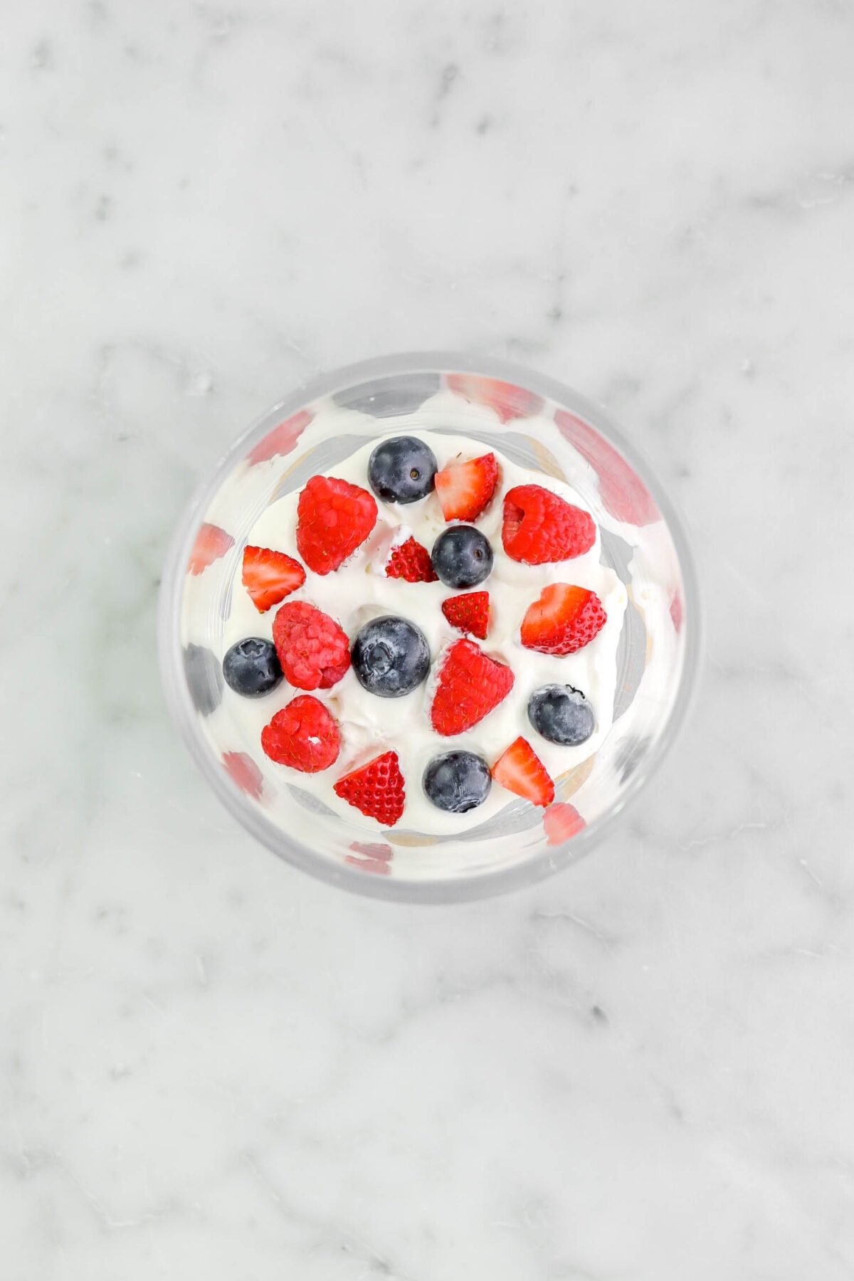 fresh berries added on top of whipped cream.