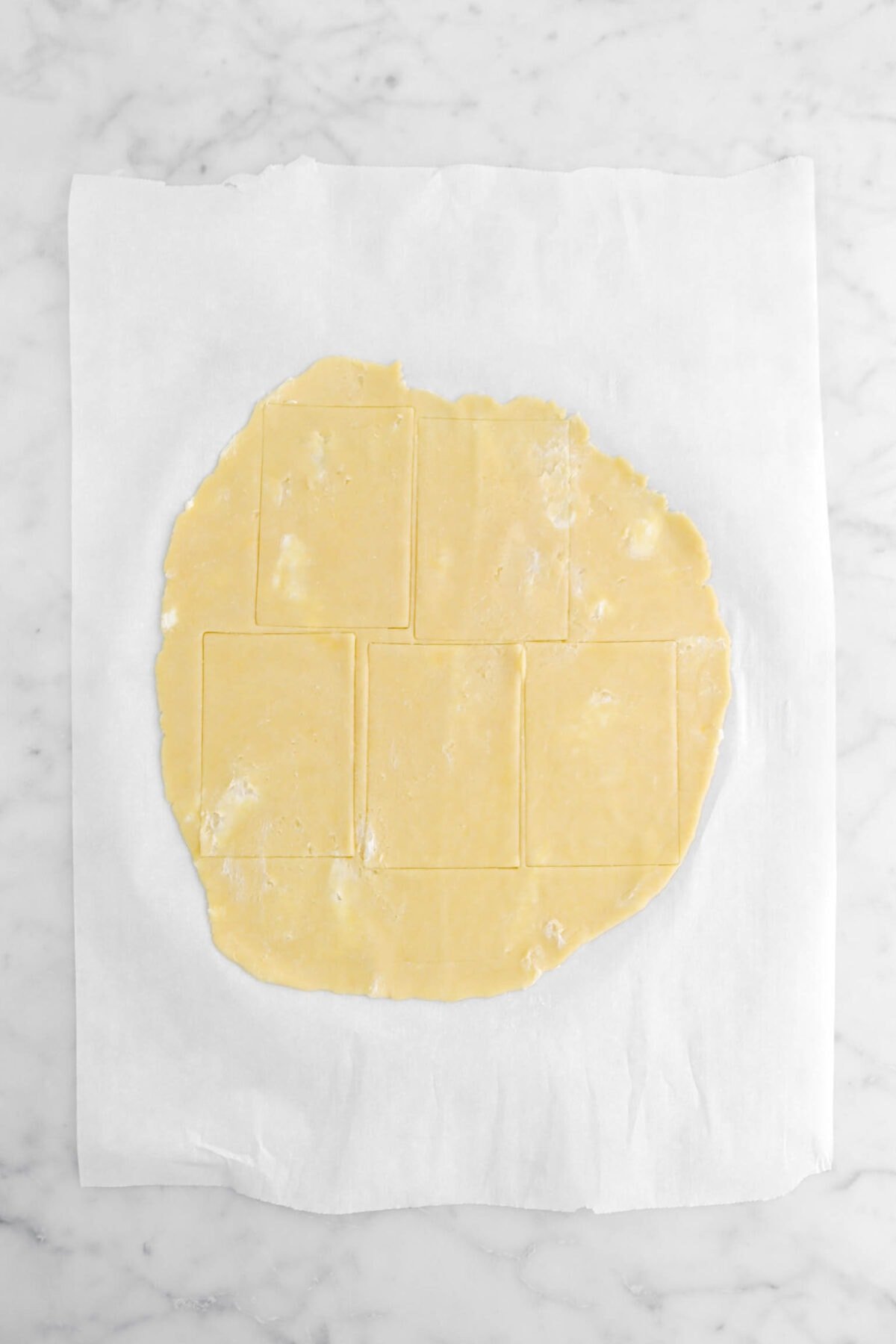 five rectangles cut into rolled out pie dough.