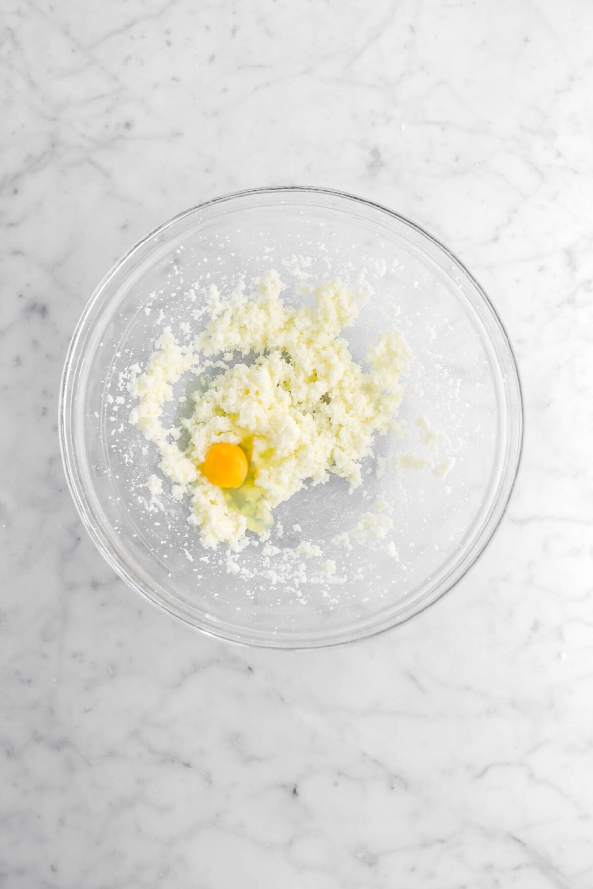 egg and creamed butter in glass bowl.