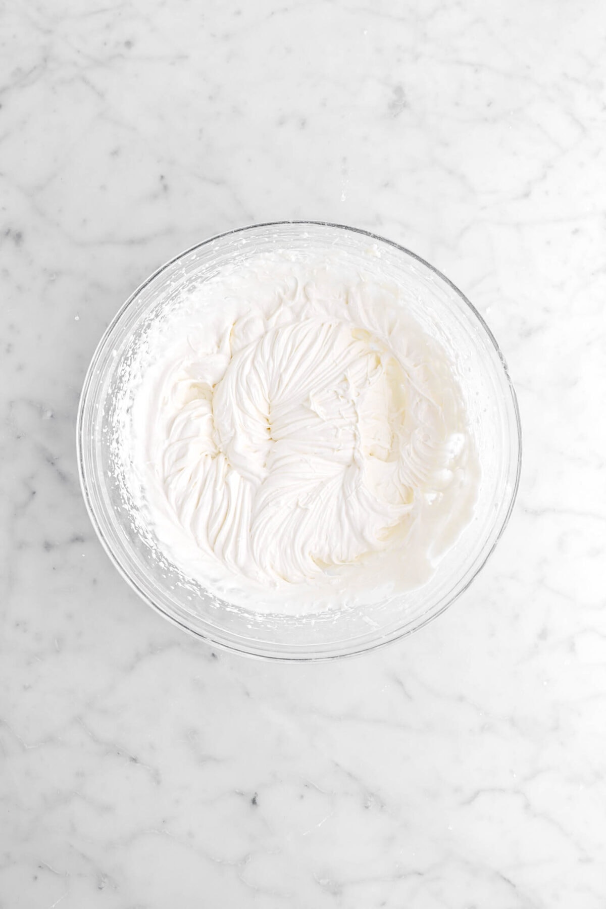 cream cheese frosting in glass bowl.