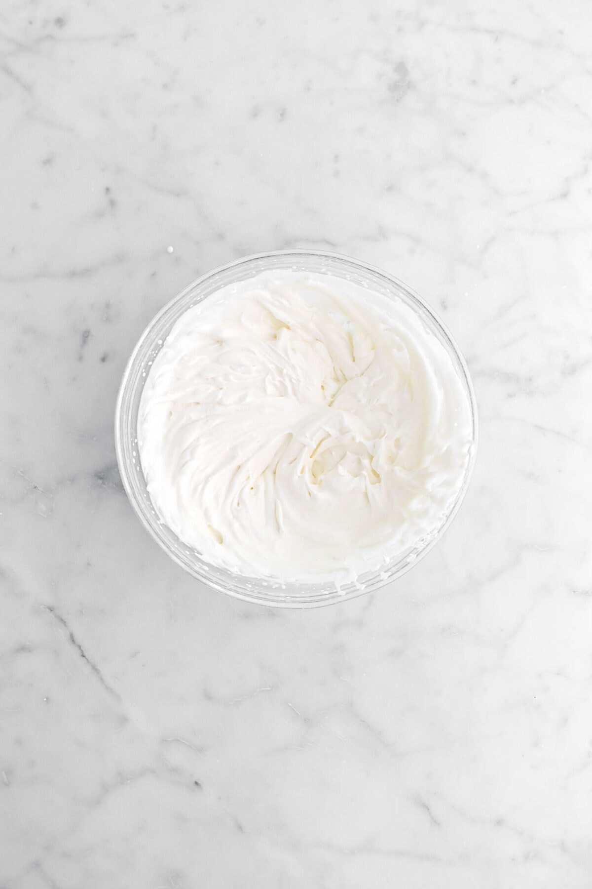 mascarpone whipped cream in glass bowl.