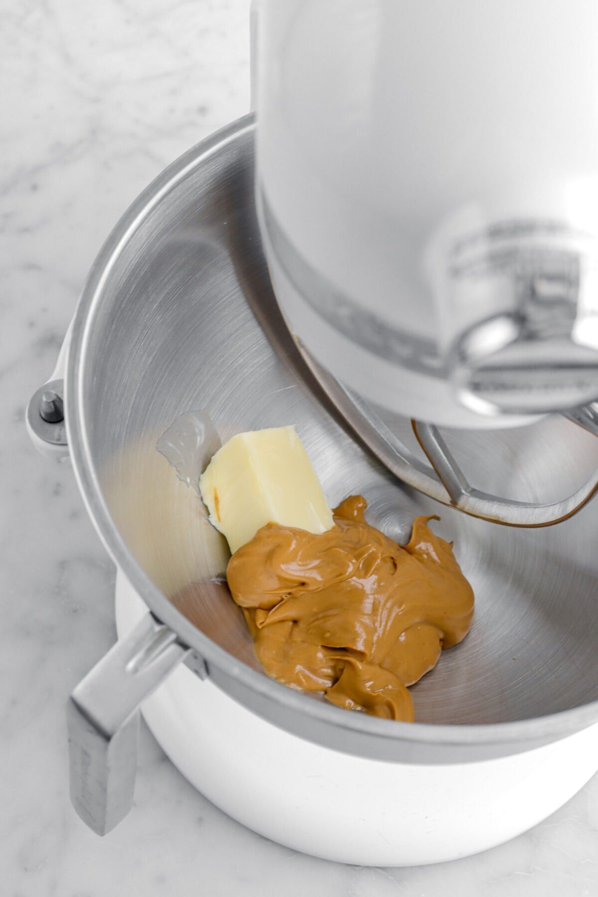 butter and peanut butter in stand mixer.